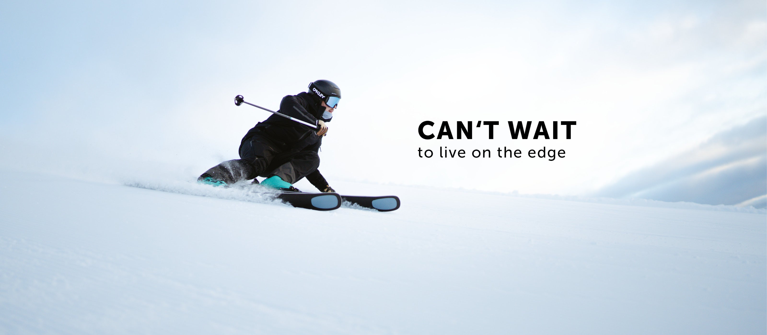 Person skiing down a snowy slope with text 'CAN'T WAIT to live on the edge' on a light blue background